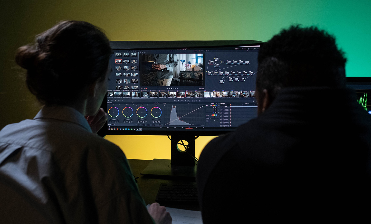 Photo of two employees doing the color correction